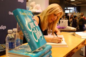 Emily signing books